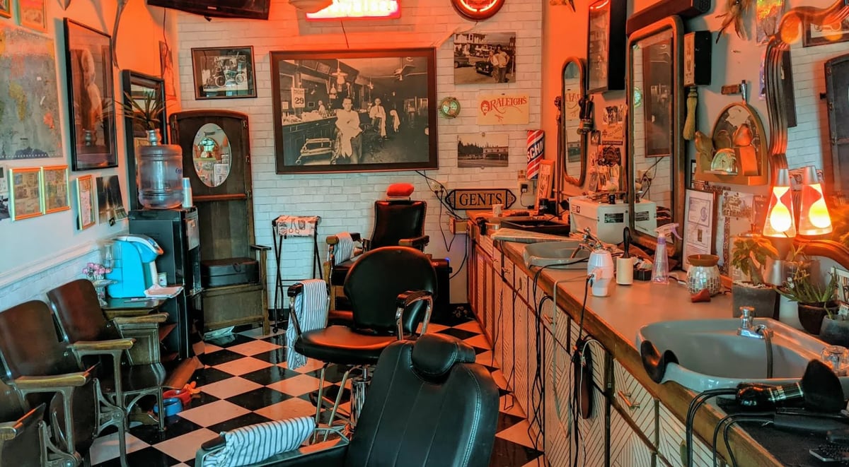 Vintage barber shop interior with retro decor, barber chair, checkered floor, memorabilia on orange walls, and warm lighting
